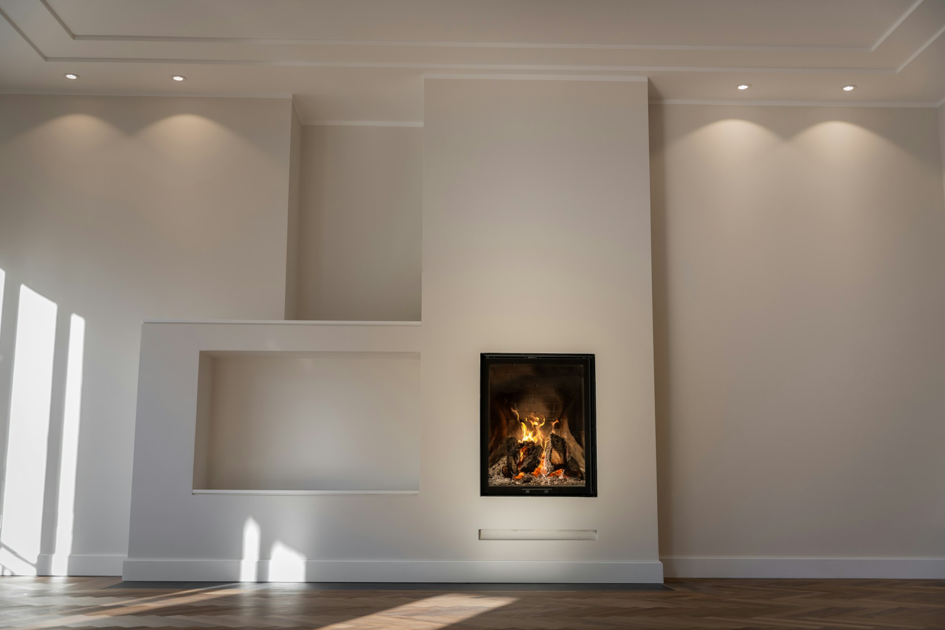 Modern wood fireplace with roaring fire in Canterbury home - A-One Chimney Cleaning